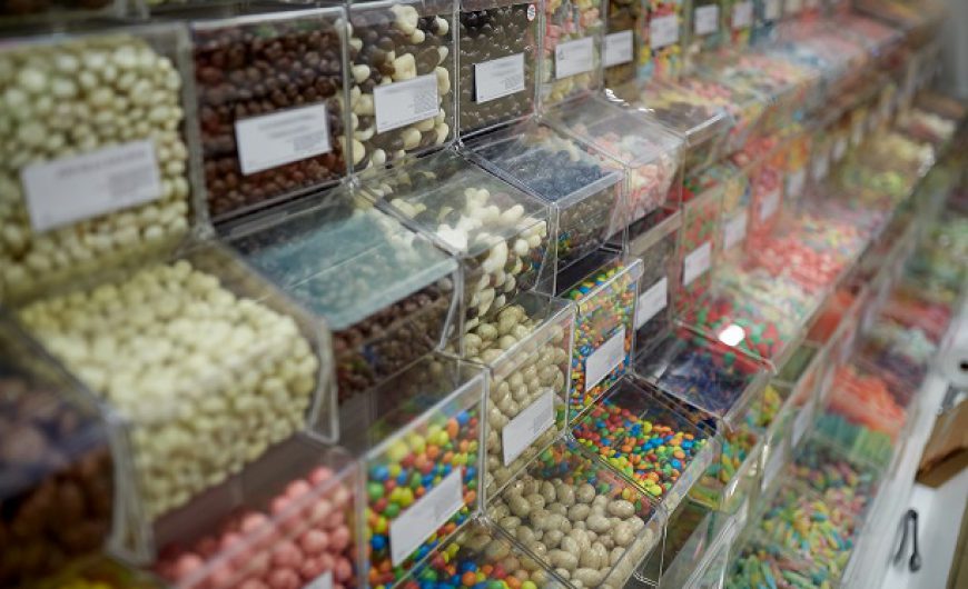 different sweets in boxes at candy shop