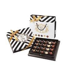 BOLCI.בונב פסים שחור ו לבן פרלינים 270 גרם 8\1